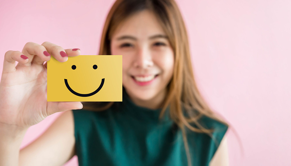 Customer Experience Concept, Happy Woman Show Excellent Rating with Smiley Face icon for her Satisfaction on Card 